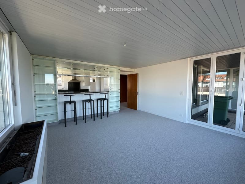 empty room, glass shelves, black stools, sliding glass doors, carpeted floor, large windows