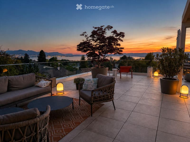 Outdoor terrace with a view of the sunset, featuring a sofa, chairs, a table, and decorative lamps.