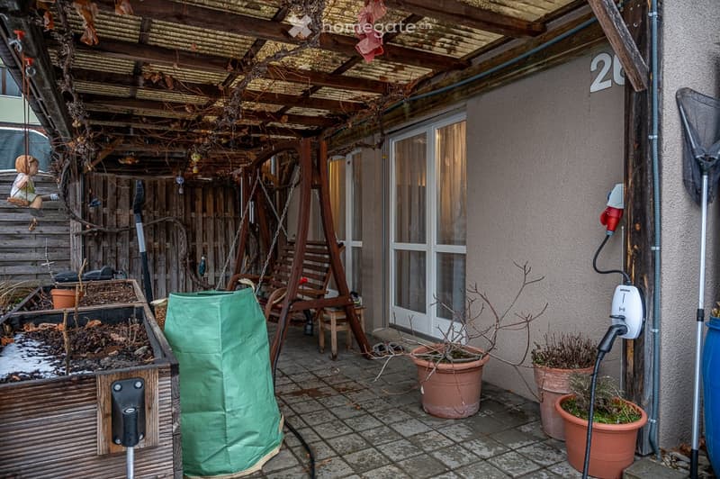 {"visible_features": [], "type": "Garden / Outdoor Area", "objects": ["chair", "swing", "planter", "planter", "planter", "planter", "planter", "planter", "planter", "planter", "planter", "planter", "planter", "planter", "planter", "planter", "planter", "p