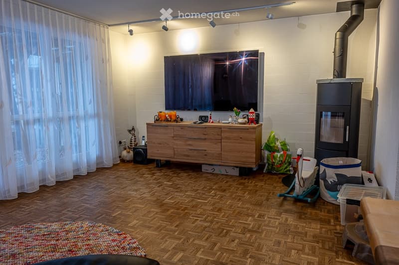 {"visible_features": [], "type": "Living Room", "objects": ["rug", "tv", "entertainment center", "speaker", "plant", "basket", "storage box", "toy", "storage container", "storage box", "storage box", "storage box", "storage box", "storage box", "storage b
