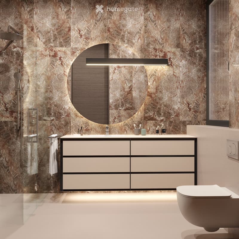 Modern bathroom with marble walls, large mirror, white vanity, and a glass shower enclosure.