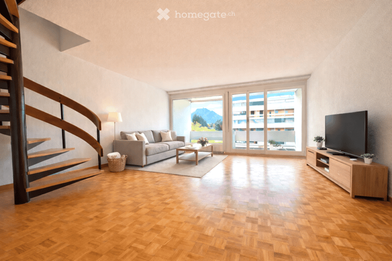 wooden floor, gray couch, coffee table, TV, lamp, spiral staircase, large windows
