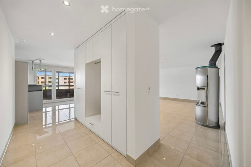 Unfurnished Room. Empty room with white walls, tiled floor, built-in wardrobes, and a fireplace.