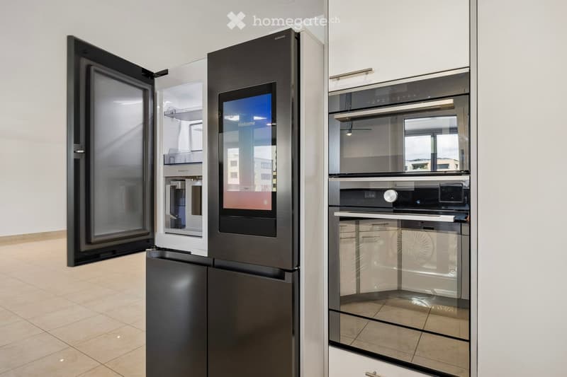 Kitchen. Modern kitchen with a refrigerator, oven, and microwave.