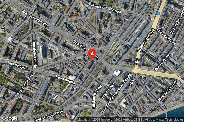 Aerial view of a city with multiple streets and buildings, marked with a red 'A'.