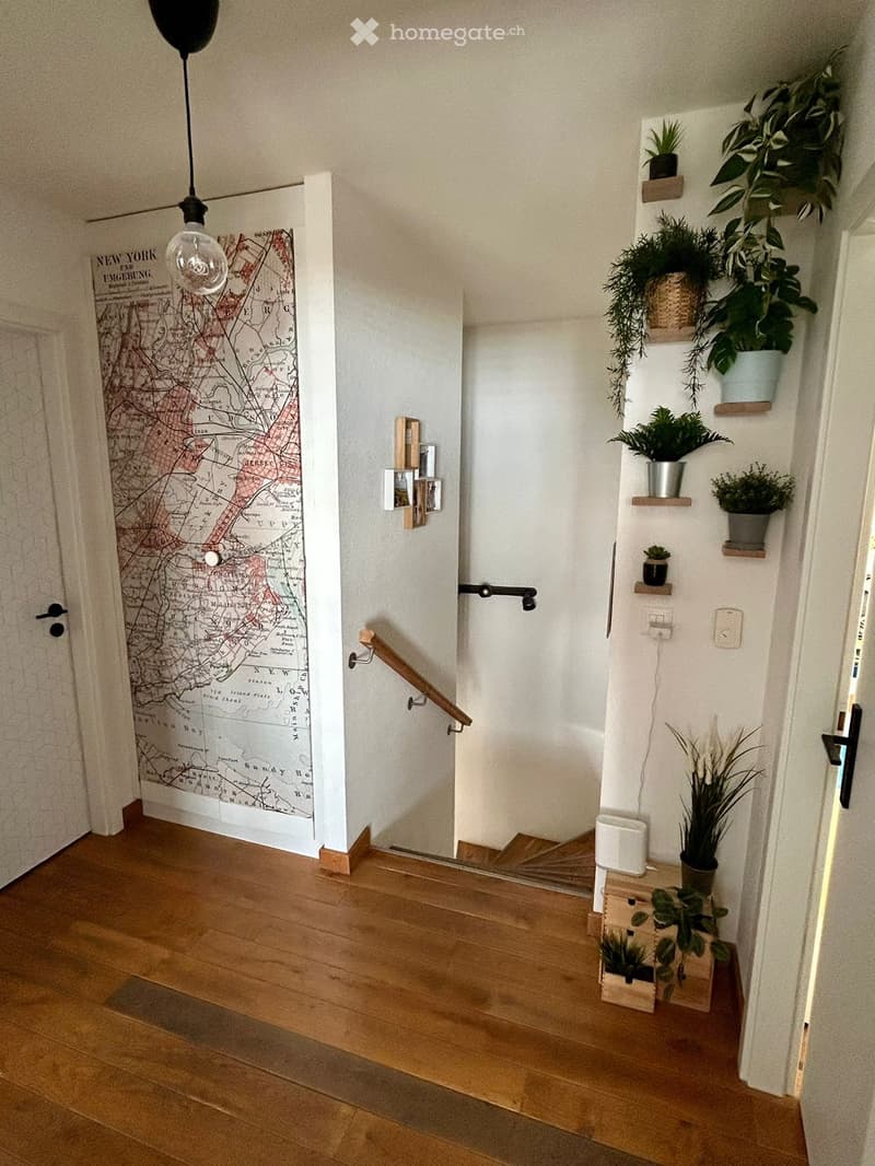 Other. {"visible_features": [], "type": "Corridor / Hallway", "objects": ["light bulb", "map", "plants", "planter", "planter", "planter", "planter", "planter", "planter", "planter", "planter", "planter", "planter", "planter", "planter", "planter", "plante