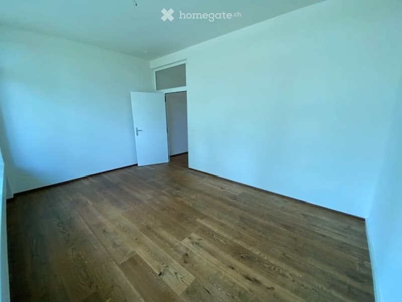 empty room, wooden floor, white walls, open door
