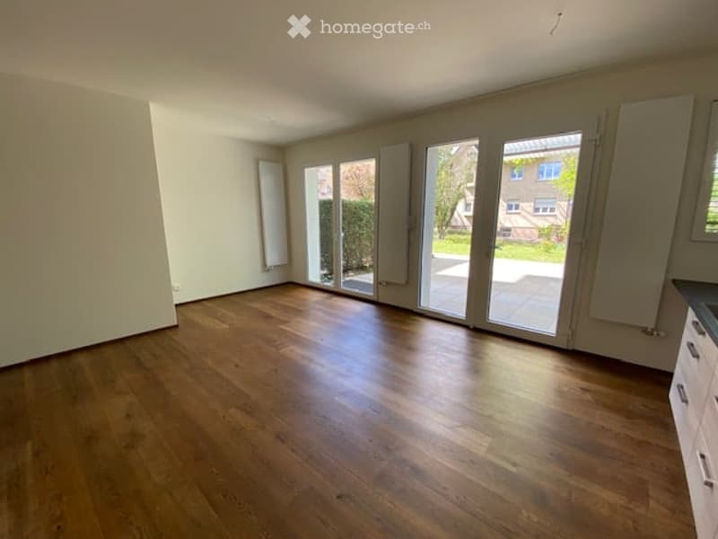 empty room, hardwood floors, sliding glass doors, white walls, white cabinets