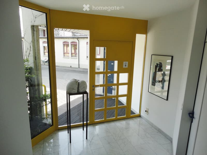 white marble floors, yellow glass walls, large door, picture frame