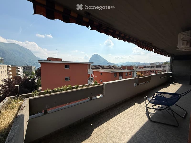 Balcony / Terrace. Terrace with a view of the mountains, a blue chair, and a planter with greenery.