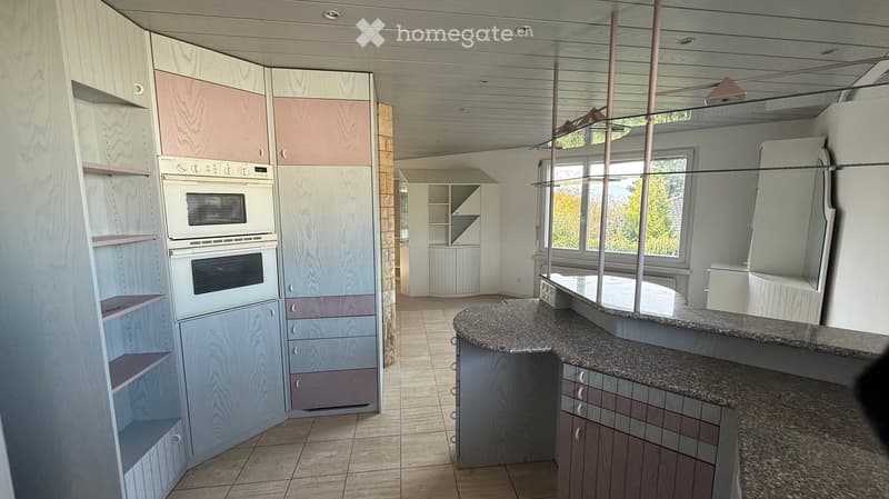 modern kitchen, granite countertops, wooden cabinets, double oven, dishwasher, washing machine, spacious layout, large window