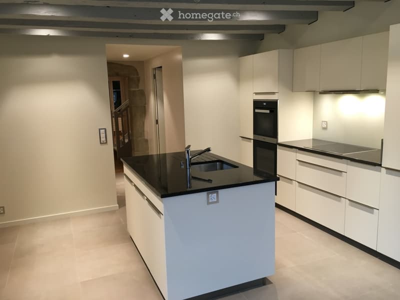 modern kitchen, white cabinets, black countertop, sink, faucet, oven, dishwasher, power outlets