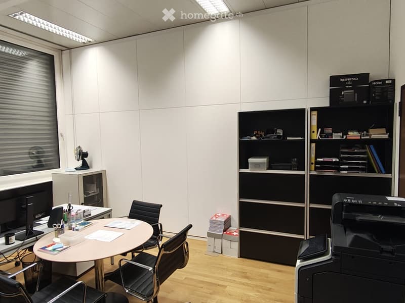 Office room: table, chairs, shelf, monitor, printer, storage boxes