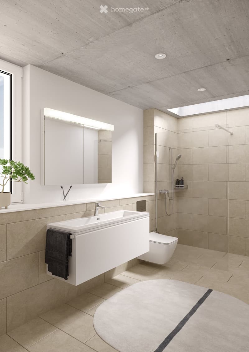 Modern bathroom with a white sink, large mirror, toilet, shower, and a round bathtub. Beige tiles and a sleek design.