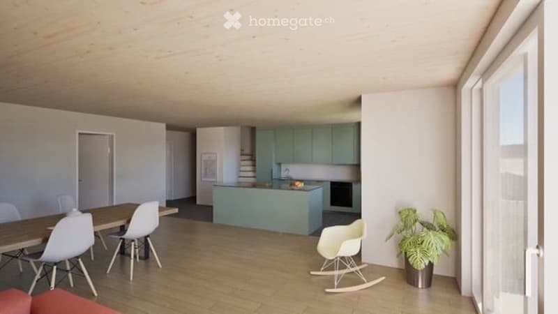 Open-plan living and dining area with light wood flooring, modern kitchen with mint green cabinets, dining table with chairs, and a rocking chair near a large window.