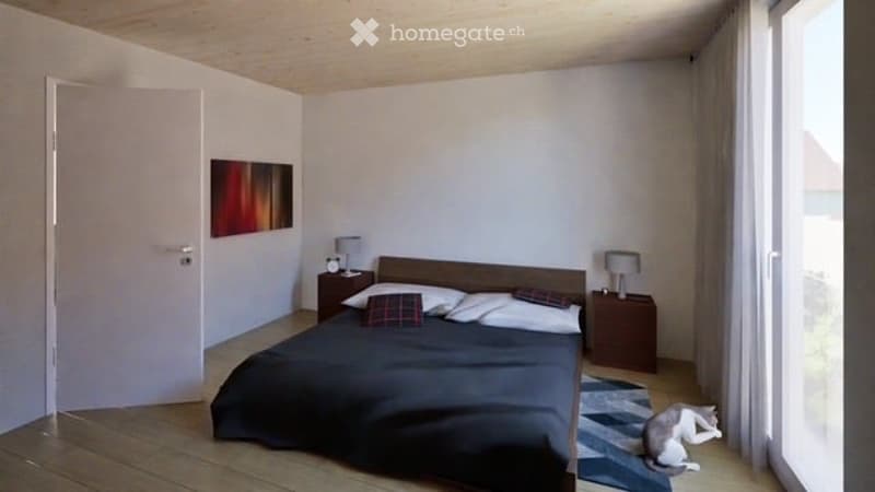 Modern bedroom with a wooden bed, nightstands, lamps, and a picture on the wall. The room features light-colored walls and wooden flooring.