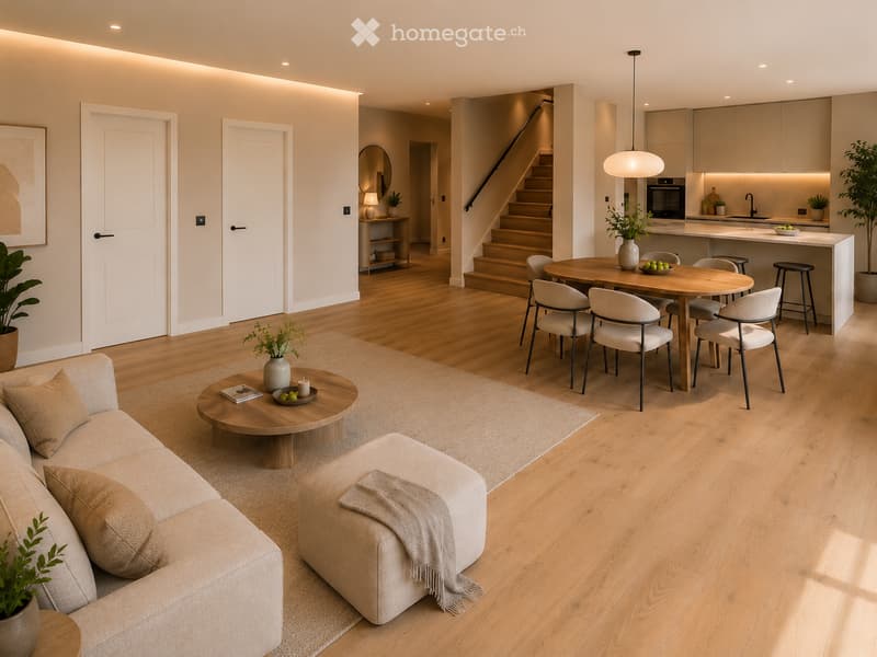 Furnished Room. Open-plan living and dining area with light wood flooring, a beige sofa, coffee table, ottoman, dining table with chairs, and a modern kitchen area with cabinets, island, and appliances.