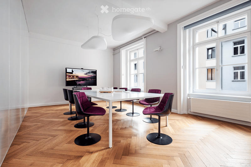 conference room, parquet floor, white desk, chairs, flat screen TV, ceiling lamps