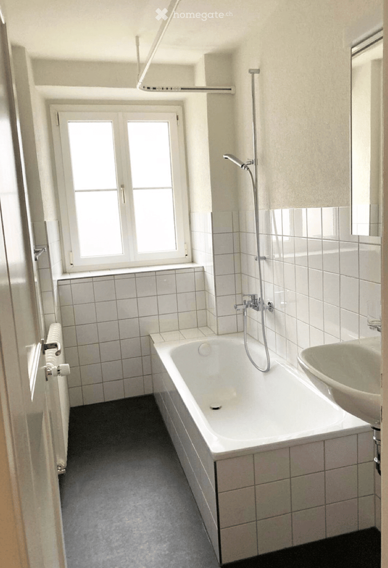 white tiles, bathtub, sink, window, radiator, shower head