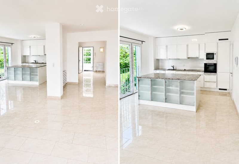Modern kitchen with white cabinets, granite countertop, and stainless steel appliances. Features large windows and a sliding glass door leading to a balcony.