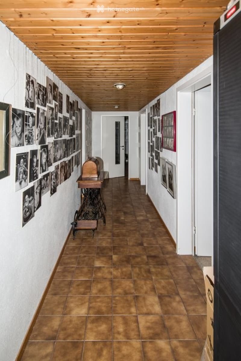 wooden ceiling, brown tiles, white walls, hallway photos, sewing machine, door, boxes