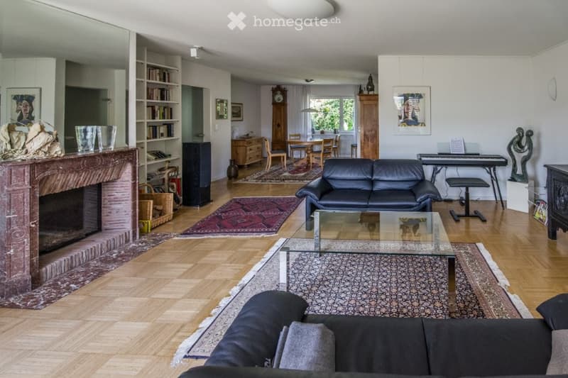 marble fireplace, wooden floor, chandelier, sofa, coffee table, piano, clock, shelves, tables and chairs