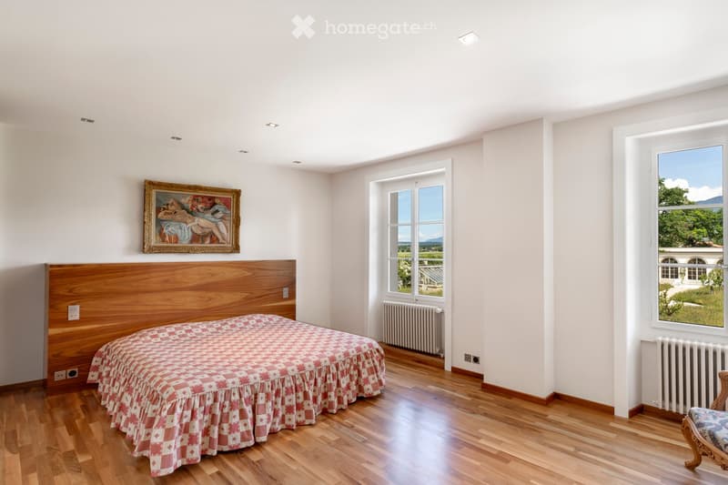 Other. {"visible_features": ["View"],    "type": "Room",    "description": "white walls, wooden floor, bed, bedside power outlets, large window, radiator, decorative painting",    "localized_descriptions":        {        "EN": "white walls, wooden f