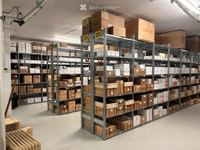 Other. Warehouse with metal shelving units filled with cardboard boxes and storage items.
