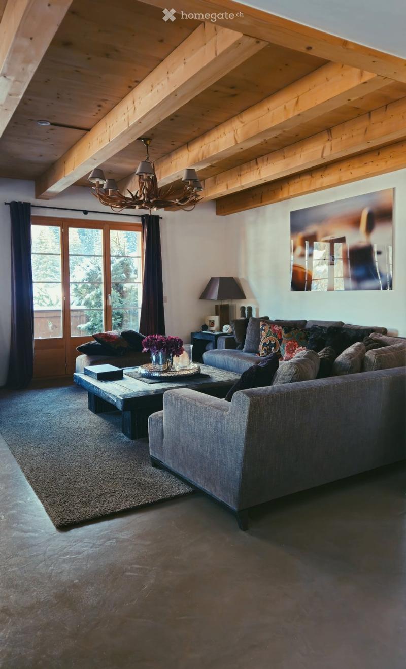 wooden ceiling, chandelier, glass window, french door, glass door, wooden coffee table, sofa, rug, painting, lamp, flower vase