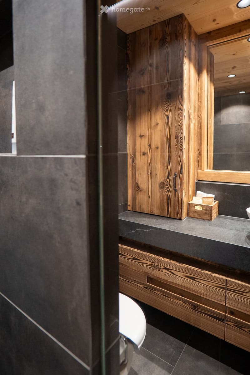 modern interior design, wooden cabinet, tiled floor, white toilet, sink, mirror