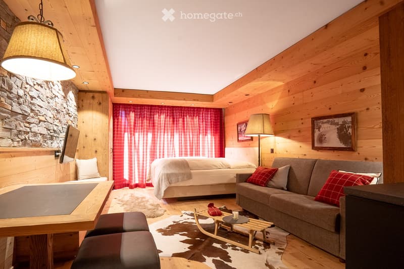 fireplace, wooden floor, cowhide rug, sofa, bed, fireplace