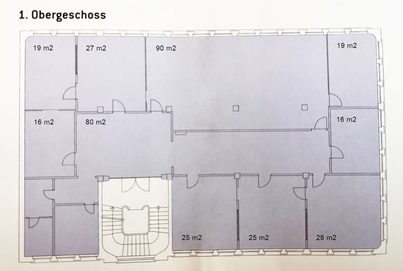 Floor plan of the upper floor showing multiple rooms with sizes labeled in square meters, including a large central space and several smaller rooms.
