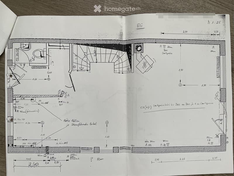 Hand-drawn floor plan of a ground floor (EG) showing layout of rooms, dimensions, and technical details. Includes kitchen, living area, bedrooms, and bathrooms.