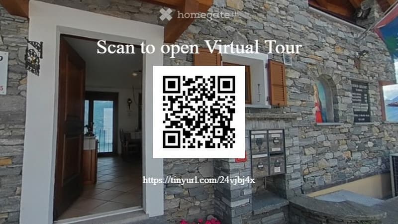 Building: stone wall, wooden door, open door, balcony, QR code