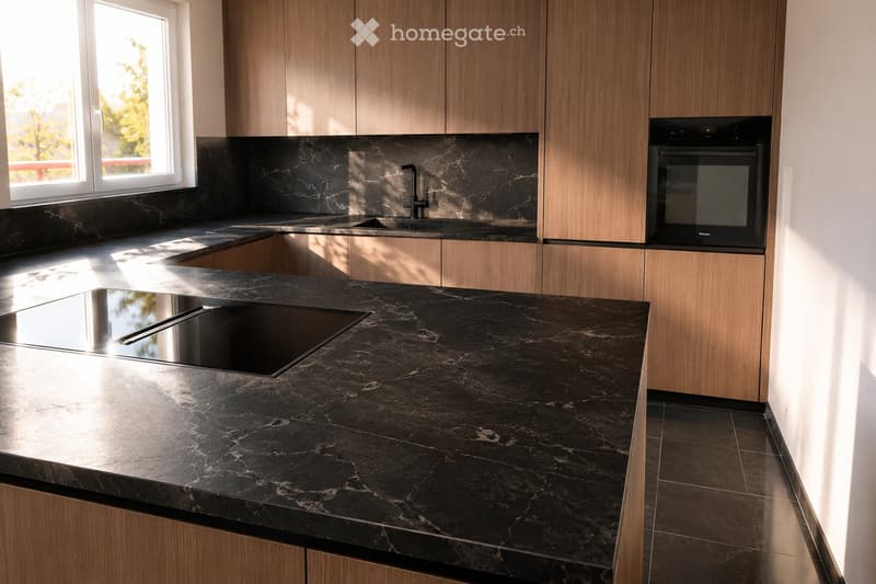 Modern kitchen with dark marble countertops, wooden cabinets, and built-in appliances including a sink and oven.