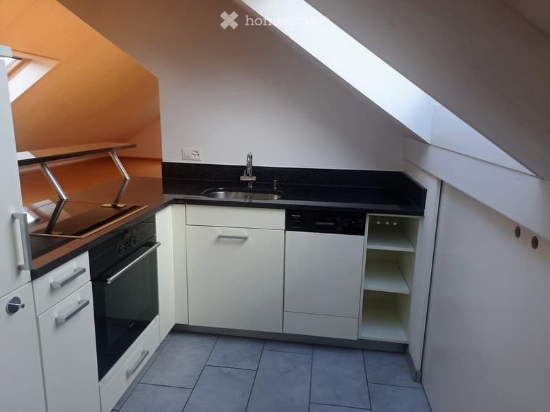 kitchen with white cabinets, black countertops, stainless steel sink, dishwasher, electric oven, tiled floor