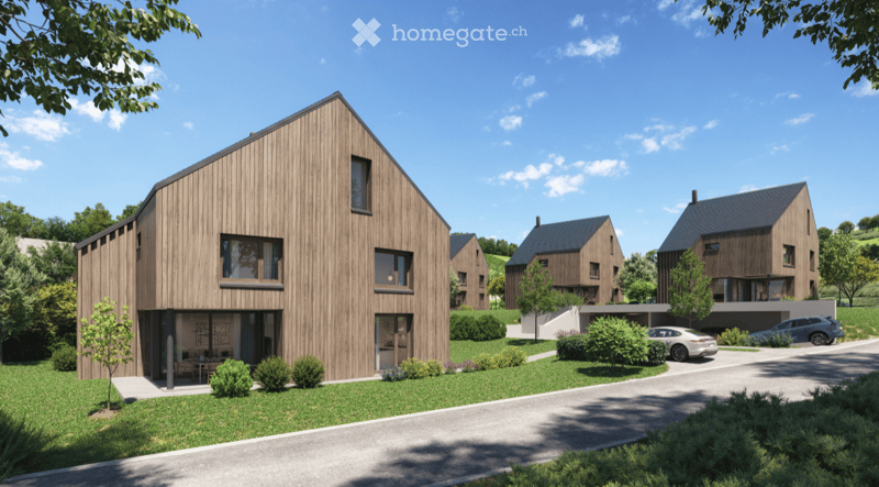Modern wooden house with large windows, a raised ground floor, and a parking area.
