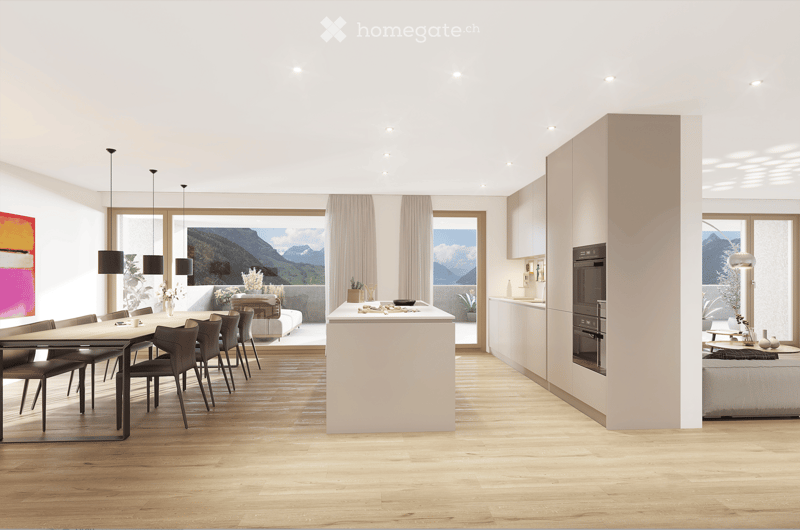 Open-plan living and dining area with modern furniture, large windows offering a scenic mountain view, and a sleek kitchen island.
