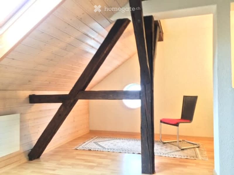 attic room, wooden beams, carpet, chair