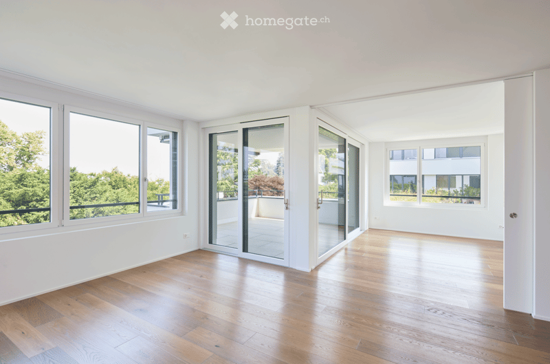 Wooden floor, white walls, sliding glass doors, balcony, large windows