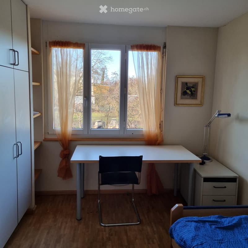 Desk, chair, bed, wardrobe, picture frame, lamp, window with curtains