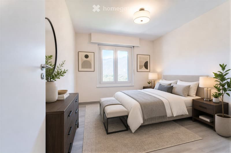 Modern bedroom with a large bed, nightstands, lamps, a dresser, a mirror, and decorative plants.