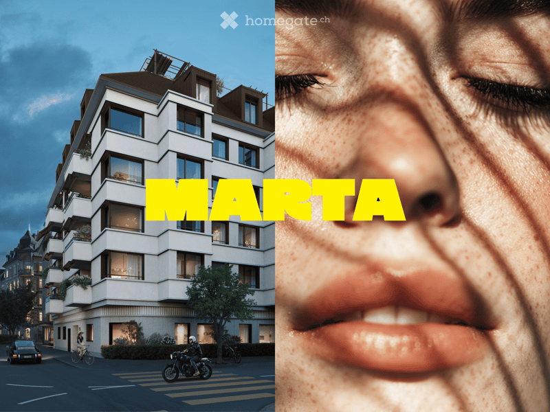 Modern multi-story residential building with balconies, large windows, and contemporary design.