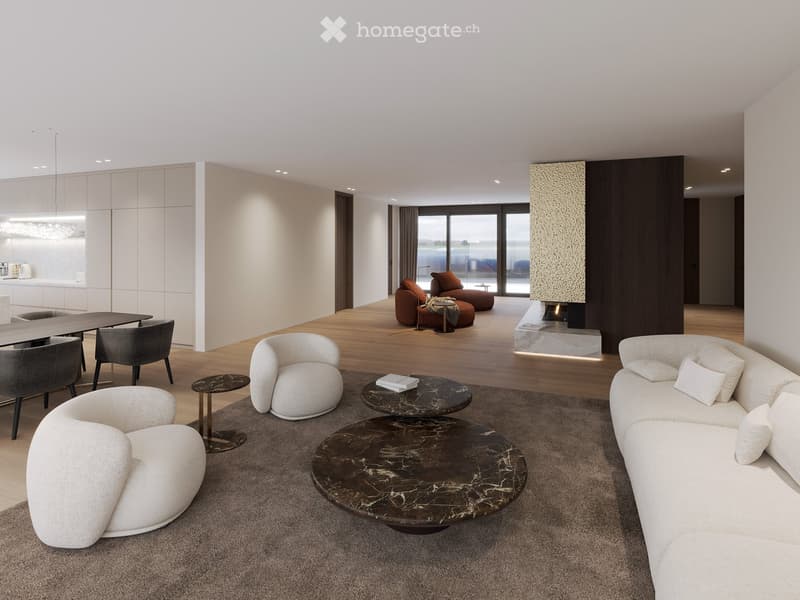 Modern living room with white walls, wooden flooring, and large windows. Features a white sectional sofa, round coffee tables, armchairs, and a fireplace.