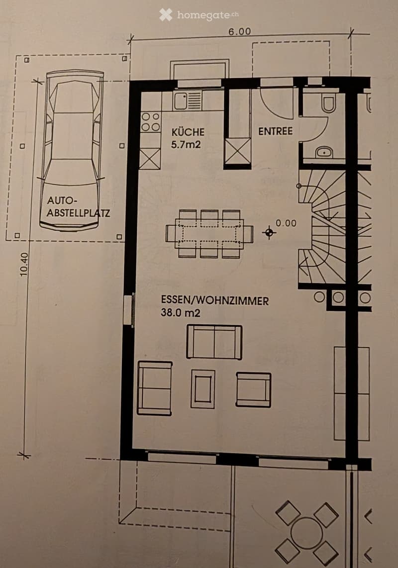 Floor plan showing a kitchen, entrance, dining/living room, and parking space.