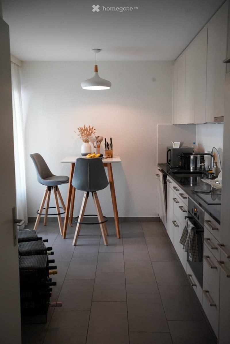 {"type": "Kitchen", "objects": ["stool", "stool", "table", "vase", "oven", "microwave", "faucet", "cupboard", "cupboard", "cupboard", "cupboard", "cupboard", "cupboard", "cupboard", "cupboard", "cupboard", "cupboard", "cupboard", "cupboard", "cupboard", "