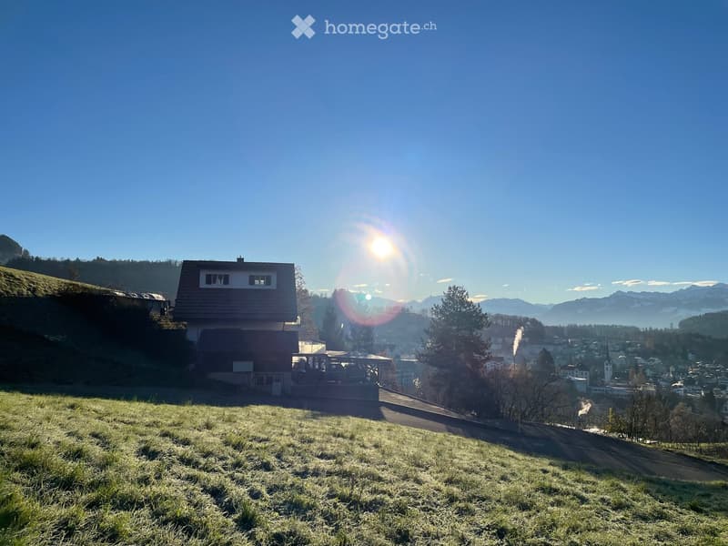 House on hill with mountain view