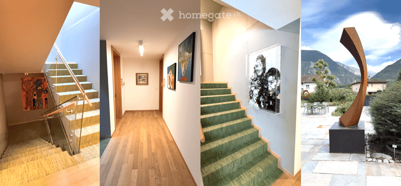 Modern hallway with wooden flooring, green carpeted stairs, glass railing, and framed artwork on walls.