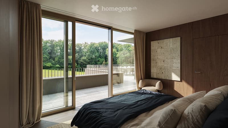 Modern bedroom with large glass doors opening to a balcony, wooden walls, a bed with dark bedding, a small chair, and a table on the balcony.