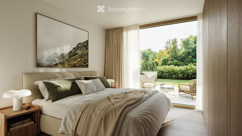 Modern bedroom with a large bed, nightstand, lamp, and a large picture frame on the wall. The room has large windows with a view of a green landscape.